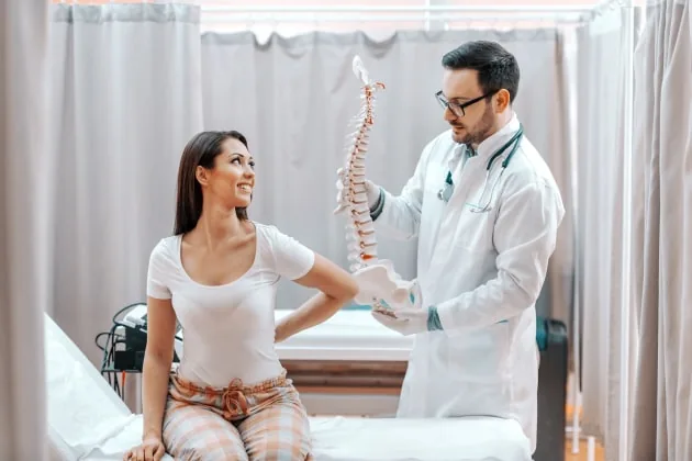 Rehabilitation specialist explaining a treatment plan to a patient